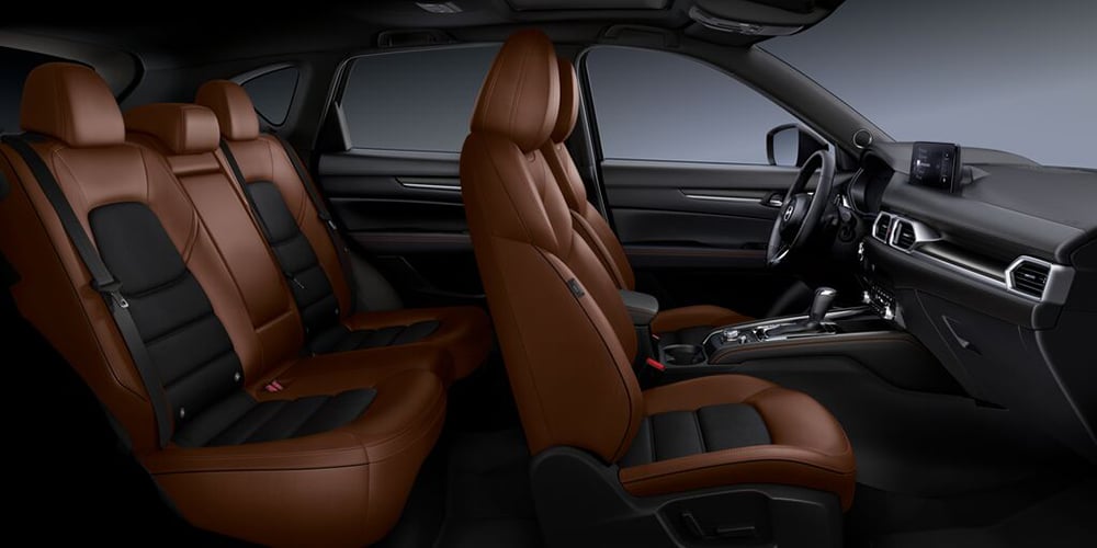 Unobstructed view of the entire CX-5 Terracotta/Black Leather interior from the passenger’s side.