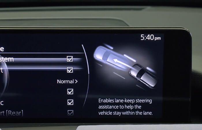 Image of CX-90 dashboard screen highlighting the safety features.