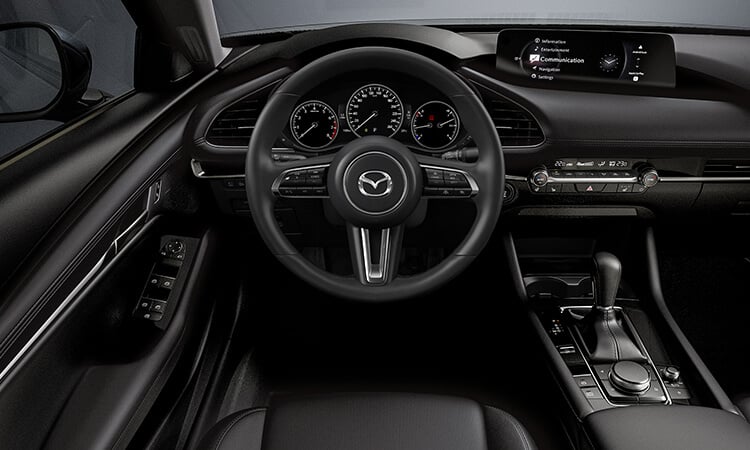 Driver’s side view inside the Mazda3 Sedan cockpit. 