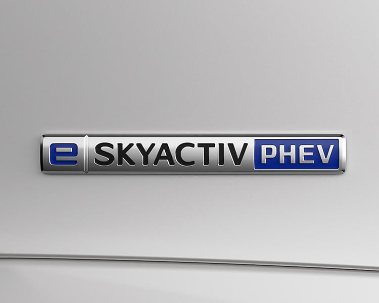 A Close up of “e-Skyactiv” PHEV vehicle badge. 