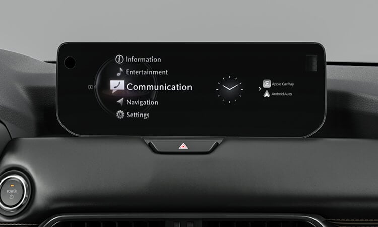 Centre infotainment display highlights “Communication”, the time of day and smartphone connectivity options. 