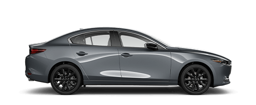 Une Mazda3 gris polymétal métallisé de profil.  