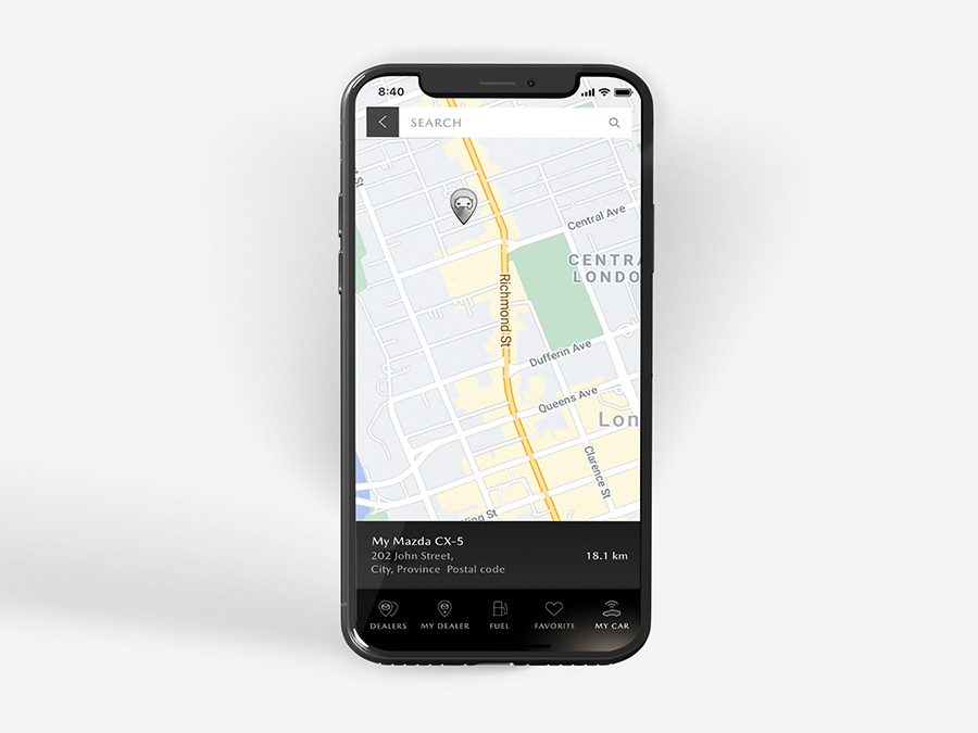 Black smartphone displaying MyMazda app’s vehicle finder  pinpointing vehicle location on map.