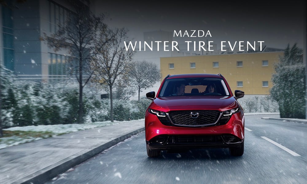A Mazda CX-5 driving on a snowy road