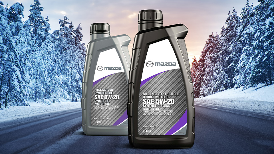 Two bottles of Mazda Genuine Synthetic Engine Oil 