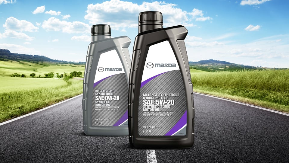 Two bottles of Mazda Genuine Synthetic Engine Oil