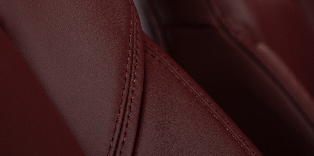 Detail of garnet red leather-trimmed seat