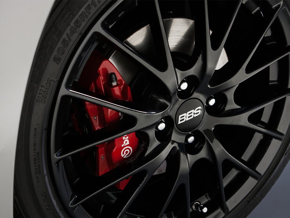 17-inch BBS® forged wheels (dark finish) with red-painted front and rear brake calipers.