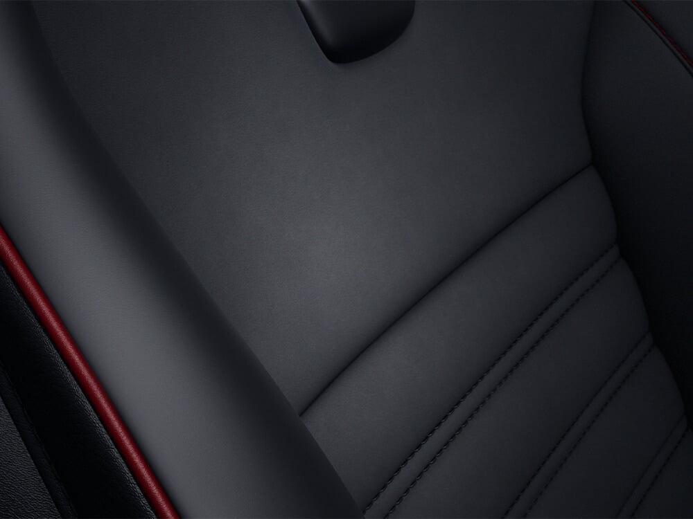 Detail of Recaro® fabric showing Nappa leather with Alcantara® piping.”
