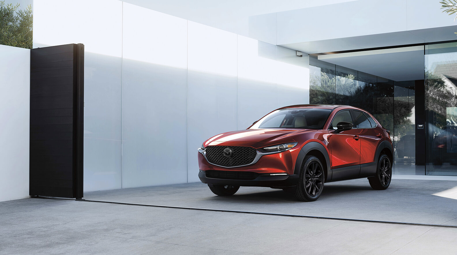Mazda CX-30 Crossover SUV parked in modern driveway