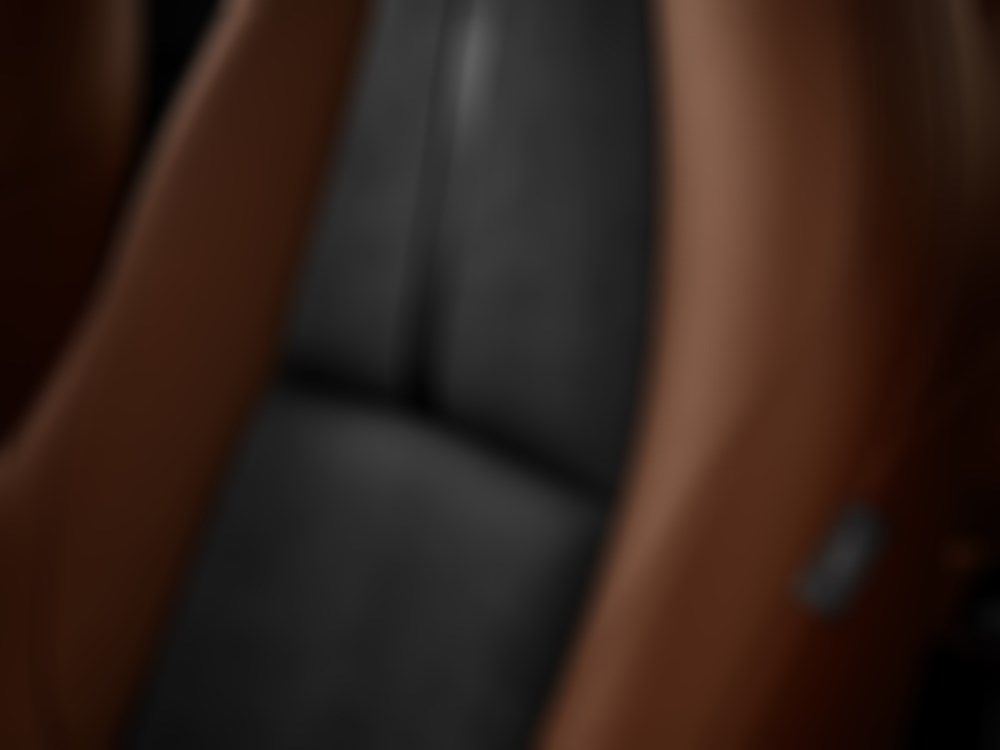 Closeup of Terracotta leatherette on driver’s seat.  