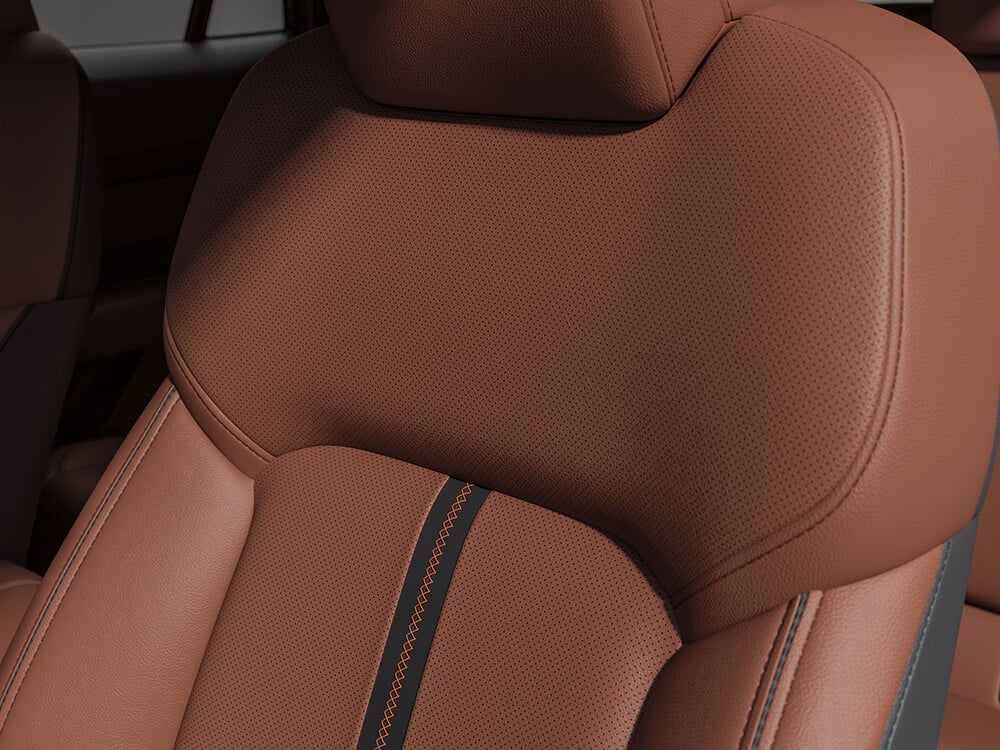 Closeup of Terracotta Leather driver’s seat. 