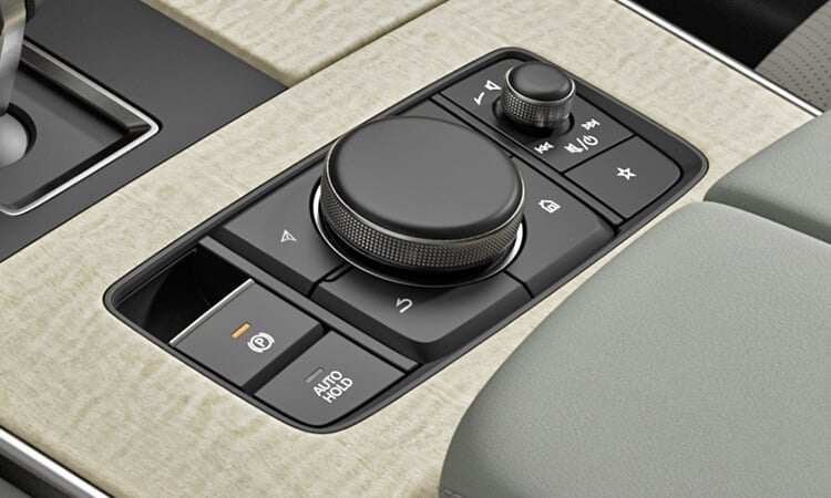 Close up of centre console material texture, dials and buttons.