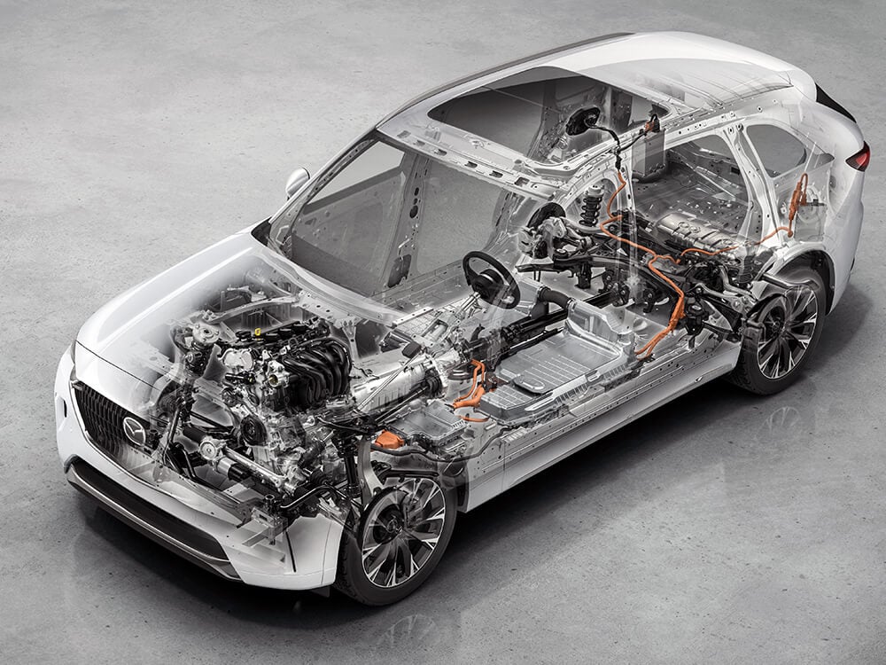X-ray, see through view of an Arctic white CX-90 revealing vehicle components under the hood andf below the floor. 