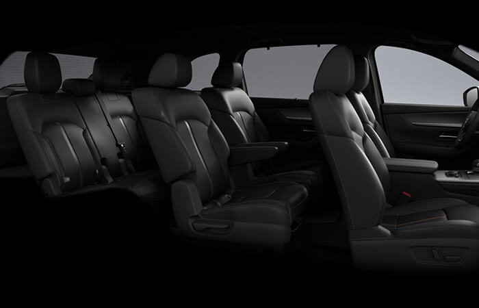 Passenger side view of all three rows of seating inside the CX-90.  