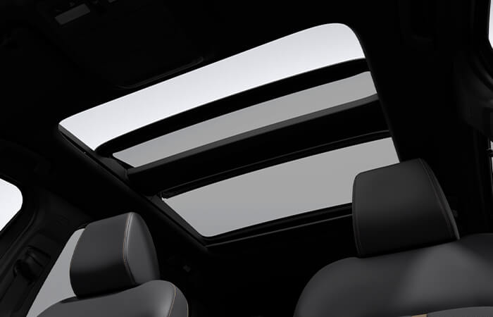 Looking up at the roof from inside the CX-90 showing the spanning Panoramic Moonroof.