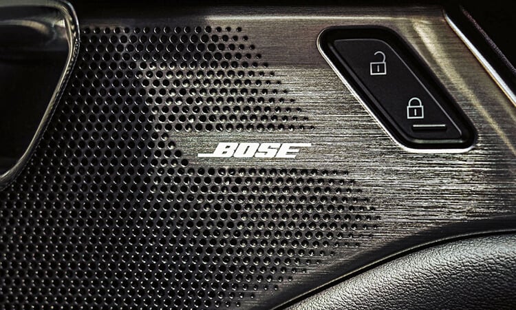 Car speaker with Bose logo. 