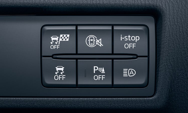 Closeup on a panel of six tactile buttons inside the MX-5.