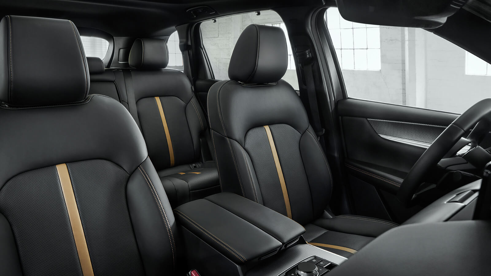 Shot of Nappa leather front seats and centre console inside the CX-70. 