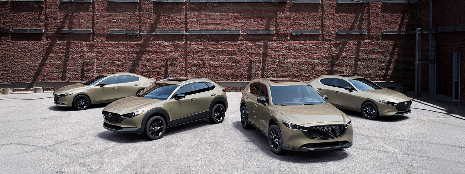 Mazda showroom with CUV, SUV, sedan, hatchback and convertible models